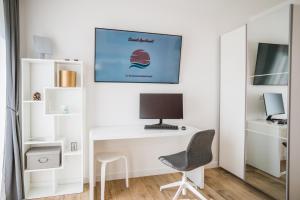 TV i/ili multimedijalni sistem u objektu Sunset Apartment