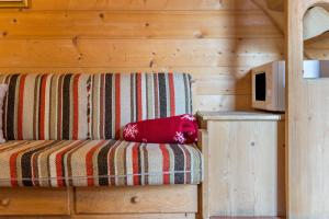 Una cama o camas en una habitación de Baita Pecol Passo Pordoi