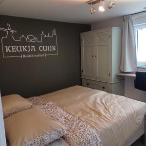 Llit o llits en una habitació de B&B Keukja Cuijk