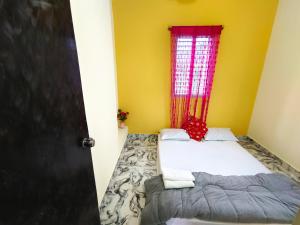 Katil atau katil-katil dalam bilik di Mannat Inn Homestay (Mysore)