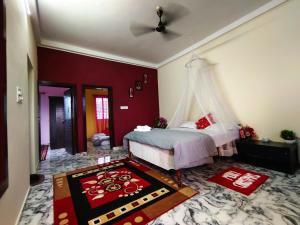 Katil atau katil-katil dalam bilik di Mannat Inn Homestay (Mysore)