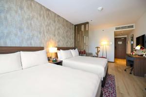 Кровать или кровати в номере Comfort Hotel Riyadh Olaya