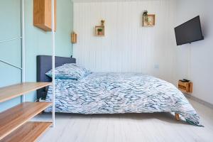 Llit o llits en una habitació de L'appartement