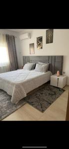 Cama ou camas em um quarto em Appartement Résidence Palm Lake Monastir