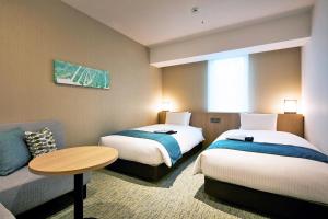 Cama ou camas em um quarto em Hotel Intergate Hiroshima