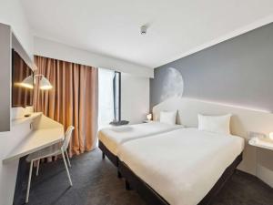 Giường trong phòng chung tại ibis Styles Paris Charles de Gaulle Airport