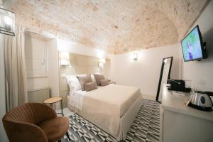 Posteľ alebo postele v izbe v ubytovaní San Marco Boutique Rooms