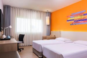 Voodi või voodid majutusasutuse Park Inn by Radisson Davao toas