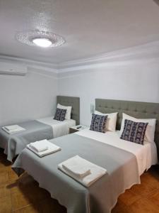 Кровать или кровати в номере Residencial Antonio Mocisso Guesthouse