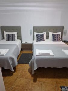 Кровать или кровати в номере Residencial Antonio Mocisso Guesthouse