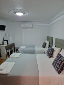 Кровать или кровати в номере Residencial Antonio Mocisso Guesthouse