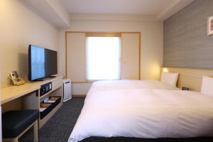 A television and/or entertainment centre at Dormy Inn Premium Ginza