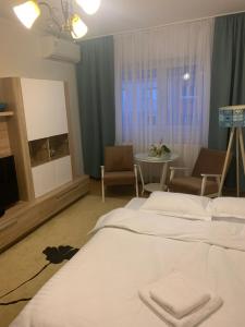 Vuode tai vuoteita majoituspaikassa Cazare Medias, apartament modern