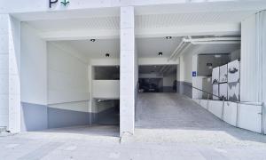 an empty hallway of a building with white columns at Haeundae Dongbeck Hotel in Busan