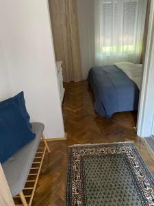 Кровать или кровати в номере Apartments & Room - Korzo