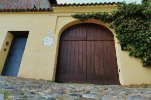 a large wooden garage door on the side of a building at Viavai in Casalborgone