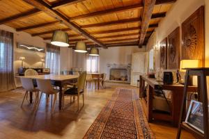 a large living room with a table and chairs at Viavai in Casalborgone