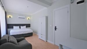 A bed or beds in a room at Centralflatsfethiye