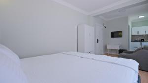 A bed or beds in a room at Centralflatsfethiye