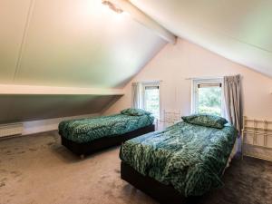 Lova arba lovos apgyvendinimo įstaigoje Comfortable holiday home on De Veluwe