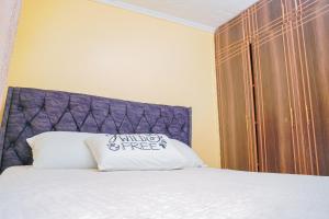 Cama ou camas em um quarto em Entire Fully furnished Villas in Kisii