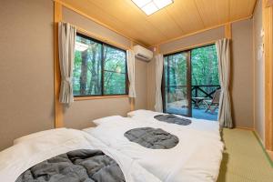 เตียงในห้องที่ S-villa Nasu 7th