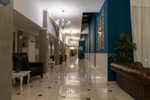 a hallway with couches and chairs in a lobby at White Rock Castle Suite Hotel & SPA in Balchik