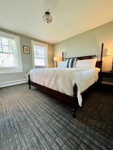 a bedroom with a large bed in a room at Gifford House in Provincetown