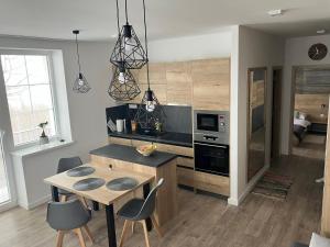 Dapur atau dapur kecil di Apartmány Vila Vlasta Vysoké Tatry