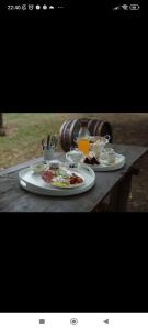 a table with two plates of food on it at Koňsky ap in Pouzdřany