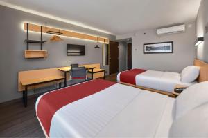 City Express by Marriott Tepic में एक कमरे में एक या कई बेड