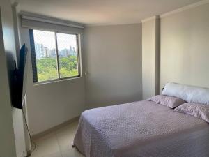 Krevet ili kreveti u jedinici u objektu Apartamento perfeito, bem localizado, confortável, espaçoso e com bom preço insta thiagojacomo