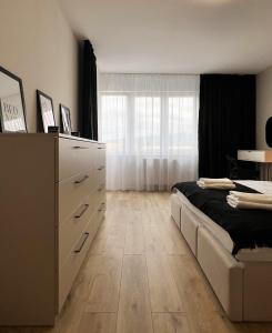 Posteľ alebo postele v izbe v ubytovaní Cozy Stay Apartment