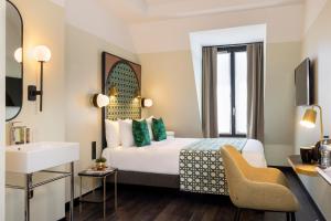 Avalon Cosy Hotel Paris में एक कमरे में एक या कई बेड