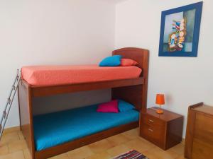 Una cama o camas en una habitación de Casa da Nelita