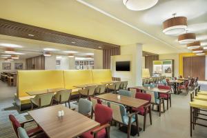 A television and/or entertainment centre at Hampton By Hilton Dubai Airport