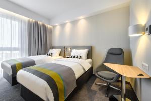 Ліжко або ліжка в номері Holiday Inn Express - Rzeszow Airport by IHG