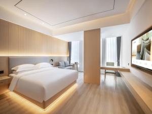 Deep Sleep Hotel Hangzhou Dajiang East Haide Xingang Center 객실 침대