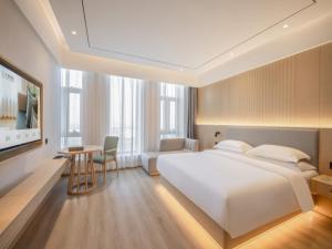 Deep Sleep Hotel Hangzhou Dajiang East Haide Xingang Center 객실 침대