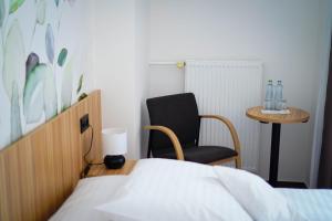 A bed or beds in a room at STEELHOUSE Hotel