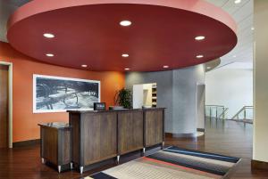 an office lobby with a large red ceiling at Hampton Inn & Suites Mt. Prospect in Mount Prospect