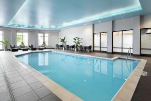 a pool with blue water in a hotel room at Hampton Inn & Suites Mt. Prospect in Mount Prospect