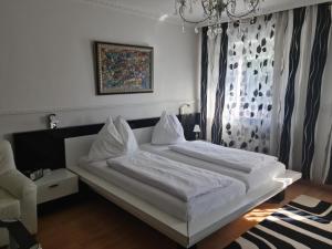 Ліжко або ліжка в номері Höckner Plaza Hotel