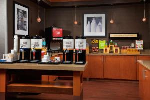 a counter with bottles of wine on a table at Hampton Inn Alamogordo in Alamogordo