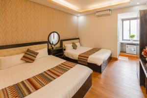 Phuong Nam Hotel में एक कमरे में एक या कई बेड