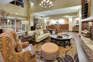 a living room with a couch and a table at Hampton Inn & Suites Mooresville in Mooresville