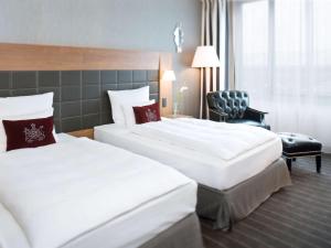 Voodi või voodid majutusasutuse Mövenpick Hotel Stuttgart Airport toas