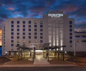 a large white building with a sign on it at DoubleTree by Hilton Hotel Niagara Falls New York in Niagara Falls