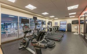 a gym with treadmills and ellipticals in a building at Hampton Inn & Suites by Hilton Moncton in Moncton