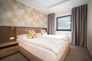 Кровать или кровати в номере Hotel Panorama Resort